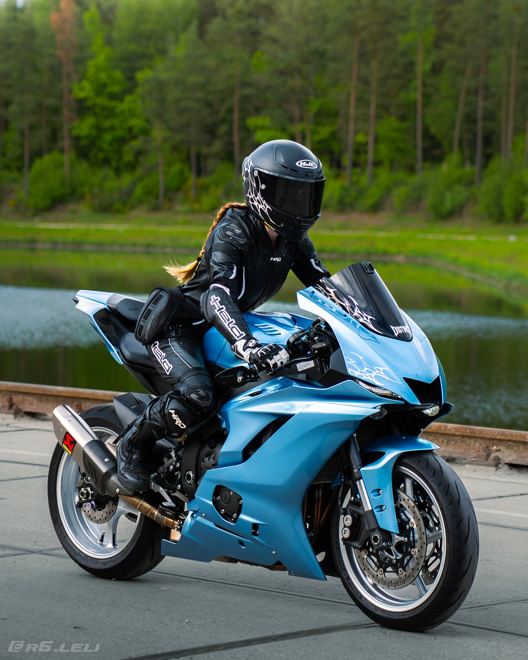 Close-up of premium blue with chrome neo-tribal decal on a motorcycle windshield - DISTINCT
