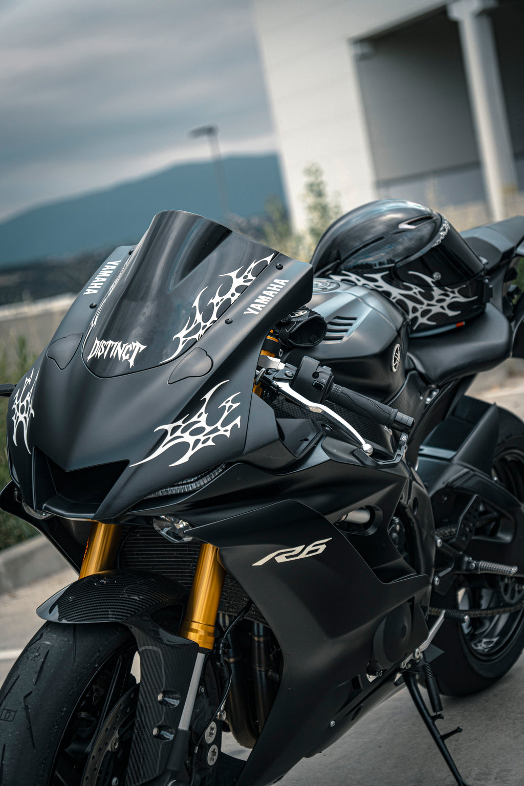 Close-up of premium matte black r6 yamaha with white reflectant neo-tribal decal on windshield