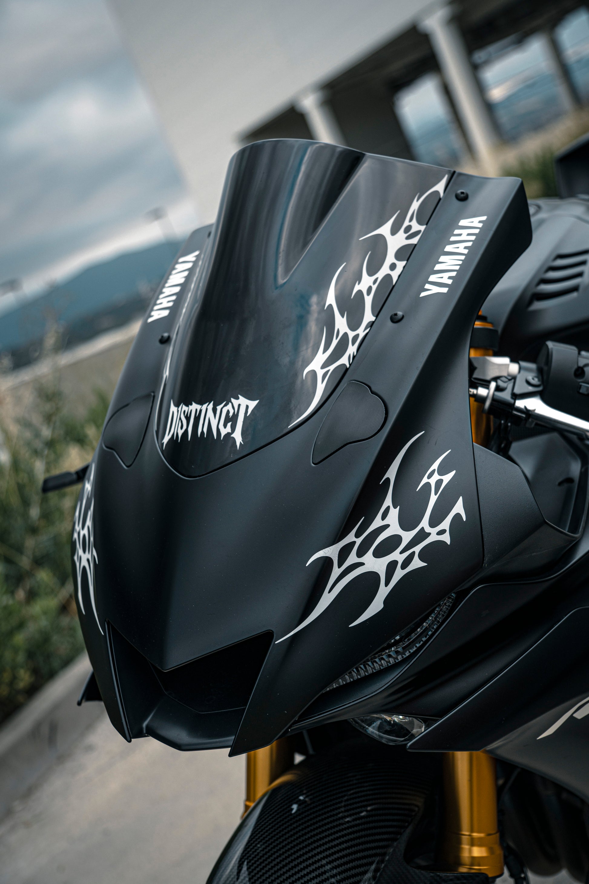 Close-up of premium white reflectant neo-tribal decal on a r6 motorcycle windshield - DISTINCT