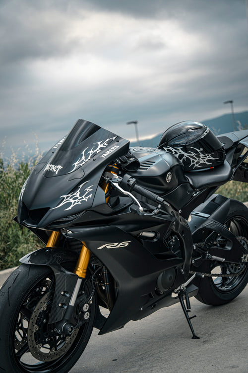 Close-up of premium white reflectant neo-tribal decal on a r6 motorcycle windshield and helmet agv pista gp rr - DISTINCT